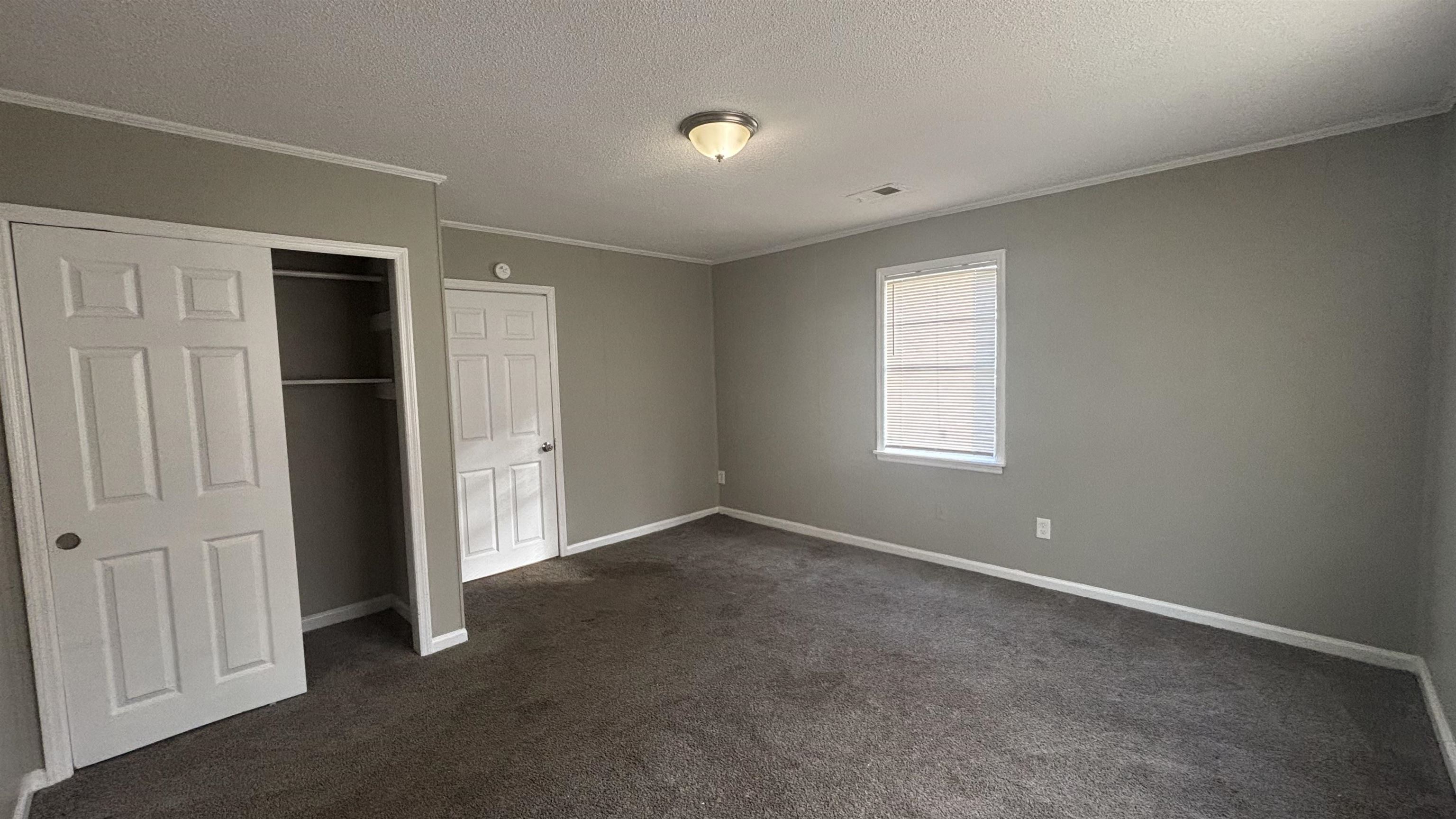 3133 Benjestown Road Memphis, TN 38127 - Photo 11 of 17 an empty room with windows and closet