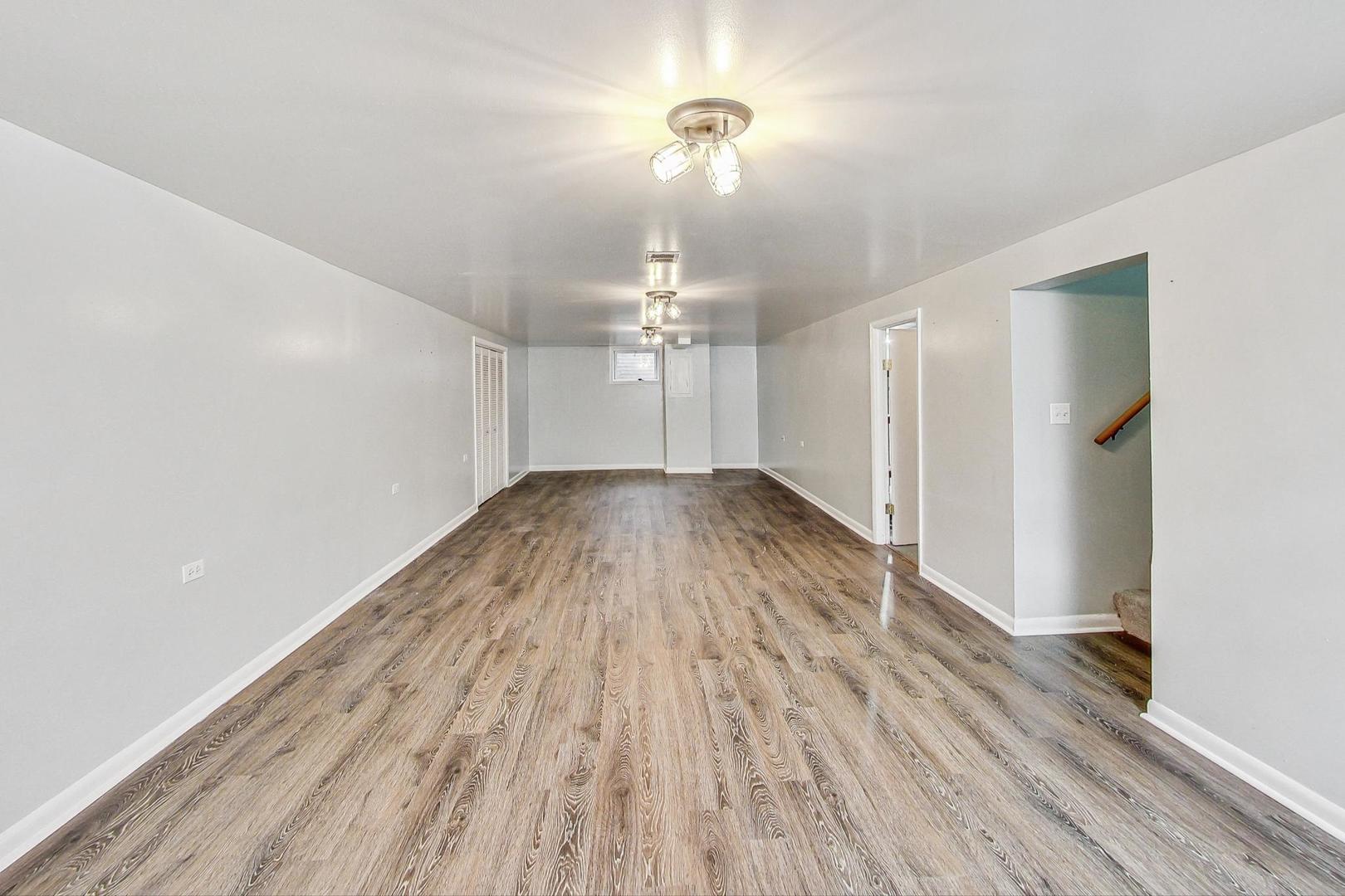 225 West Butterfield Road Elmhurst, IL 60126 - Photo 17 of 29 wooden floor in an empty room with a window