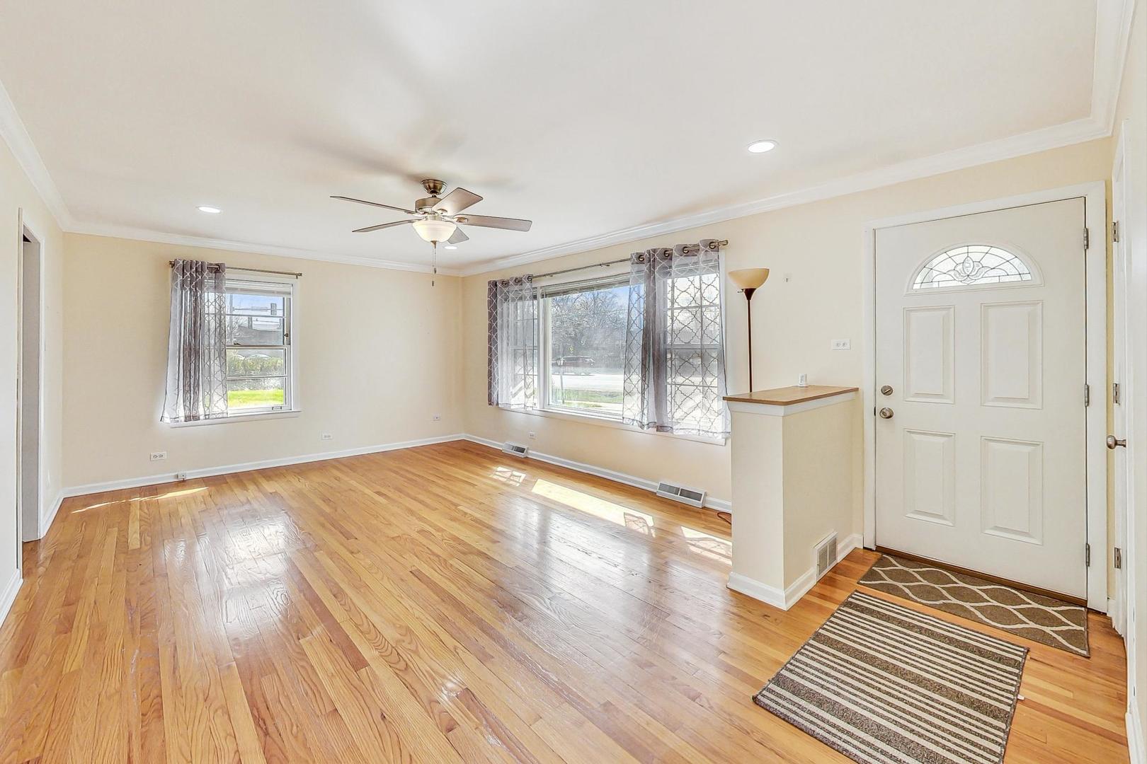 225 West Butterfield Road Elmhurst, IL 60126 - Photo 3 of 29 wooden floor in an empty room with a window