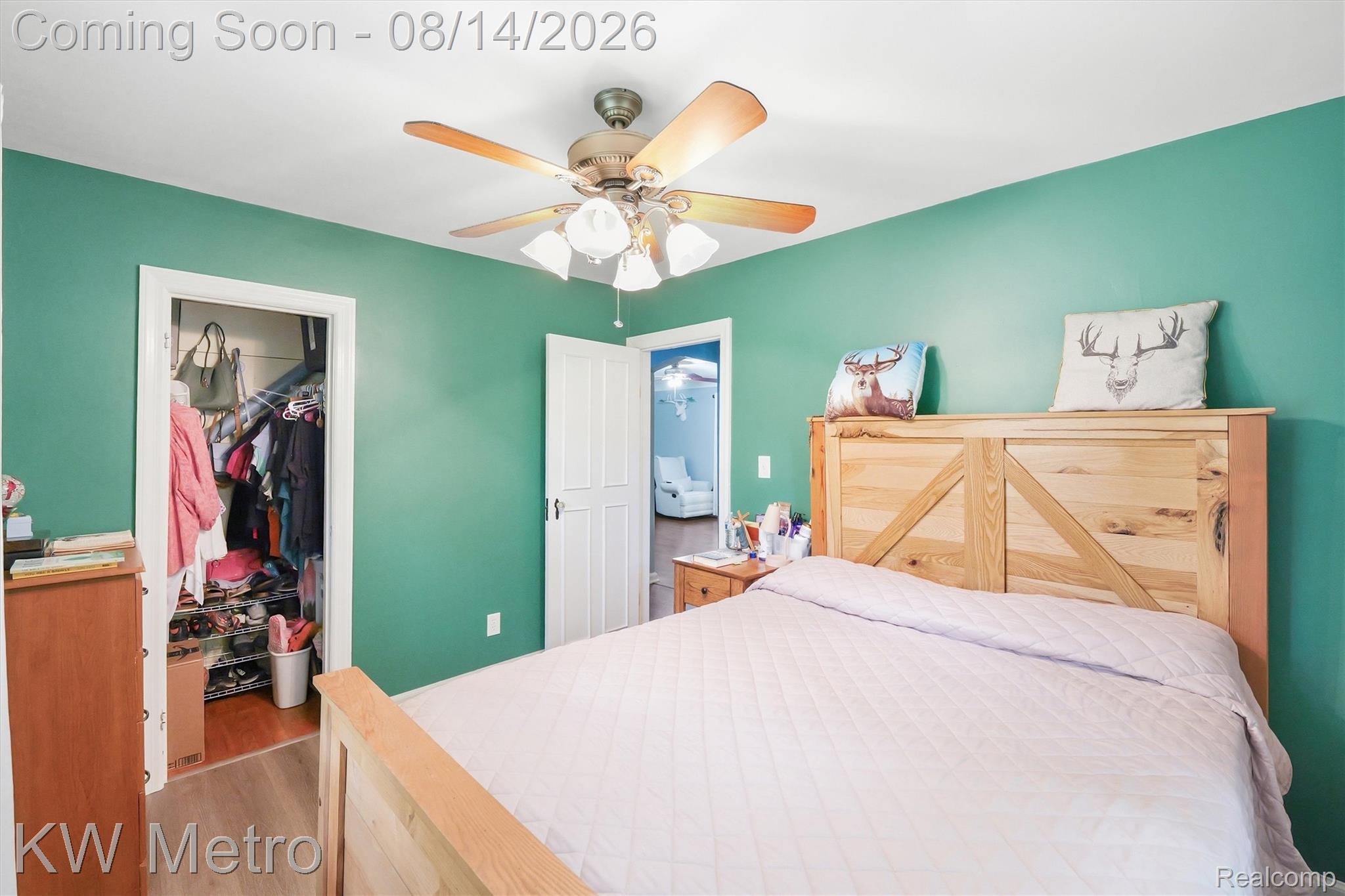 201 South Maple Leaf Road Lapeer, MI 48446 - Photo 13 of 70 Ceiling fan with integrated lighting, wood-finish flooring, and white trim