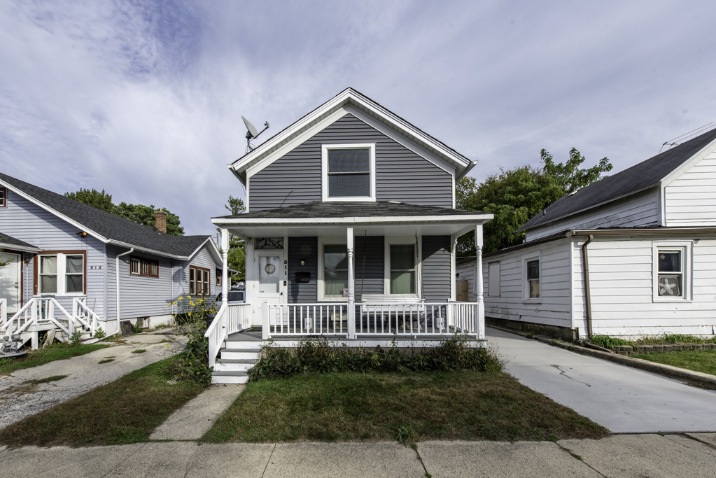 a view of a house with a yard and plants