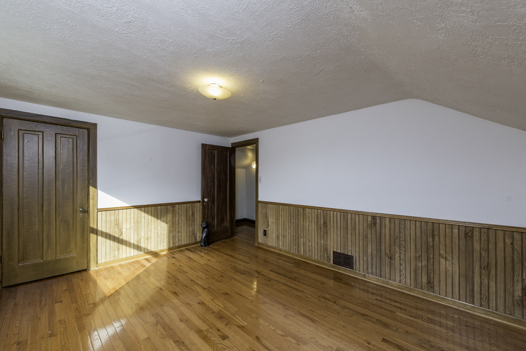 511 Chestnut Street Waukegan, IL 60085 - Photo 18 of 25 a view of an empty room with wooden floor