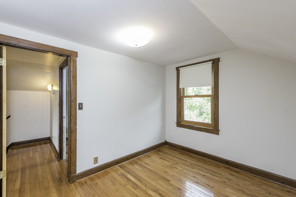 511 Chestnut Street Waukegan, IL 60085 - Photo 20 of 25 an empty room with wooden floor and windows