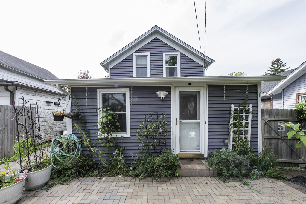 511 Chestnut Street Waukegan, IL 60085 - Photo 21 of 25 a front view of a house with potted plants
