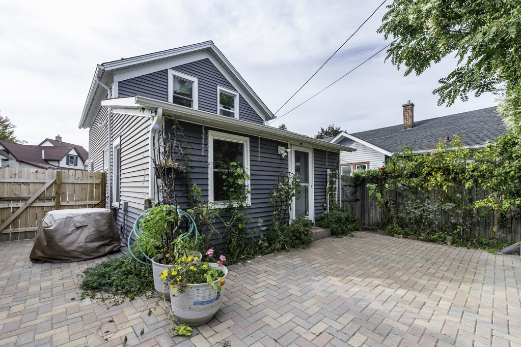 511 Chestnut Street Waukegan, IL 60085 - Photo 22 of 25 a front view of a house with a yard
