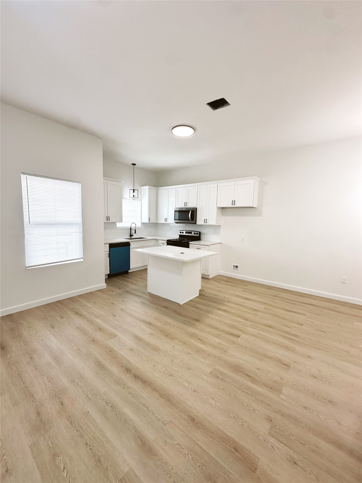 9725 Kerr A-b Street Houston, TX 77029 - Photo 5 of 22 a kitchen with stainless steel appliances a refrigerator sink and microwave