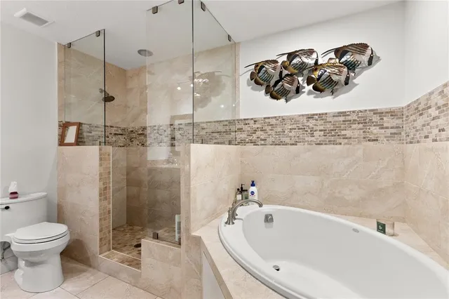 a bathroom with a bathtub a sink and a toilet