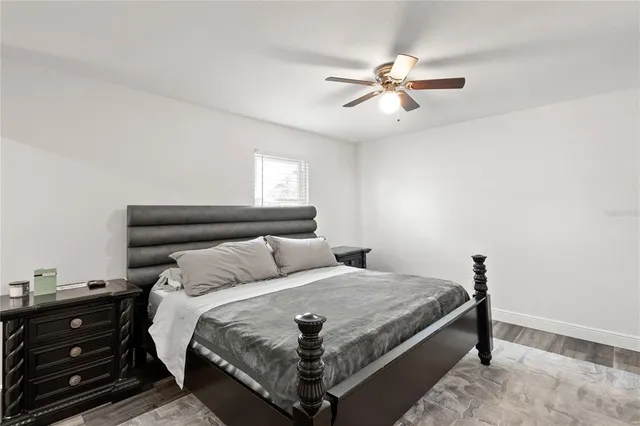 a bedroom with a bed and window