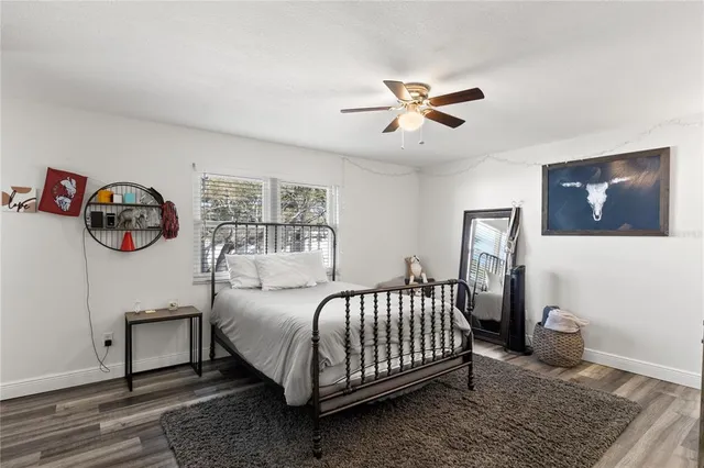 a bedroom with a bed and dresser