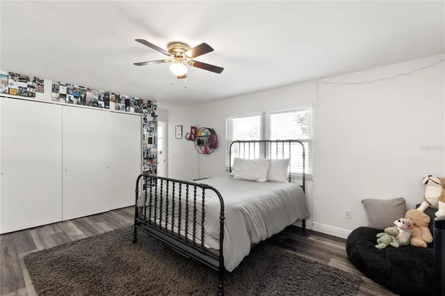 a bed room with a bed and a window