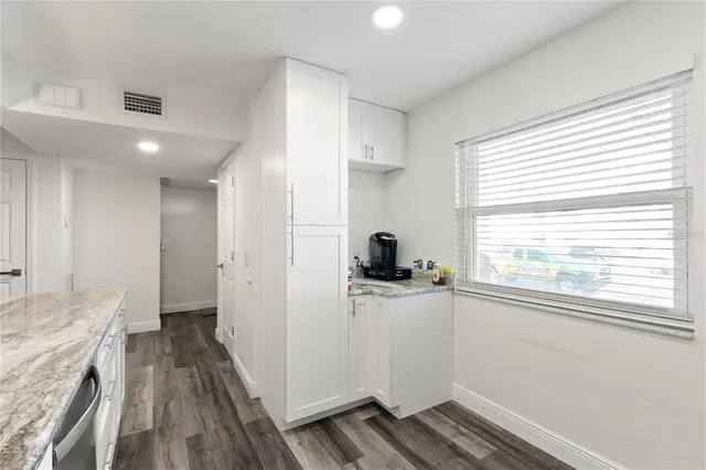 a view of a kitchen from the hallway
