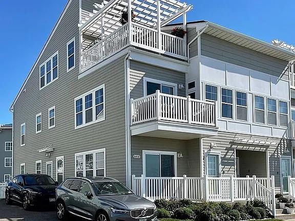 a front view of a house with parking space