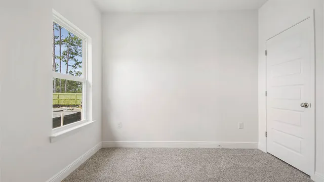 an empty room with windows