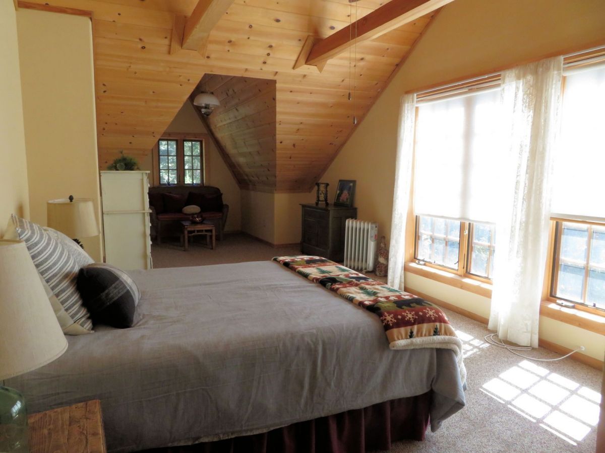 25553 Glen Rd Road Idyllwild, CA 92549 - Photo 17 of 20 a bedroom with a bed couch and a window