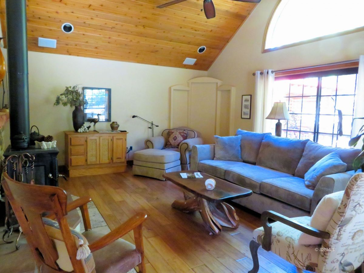 25553 Glen Rd Road Idyllwild, CA 92549 - Photo 5 of 20 a living room with furniture a rug and a window