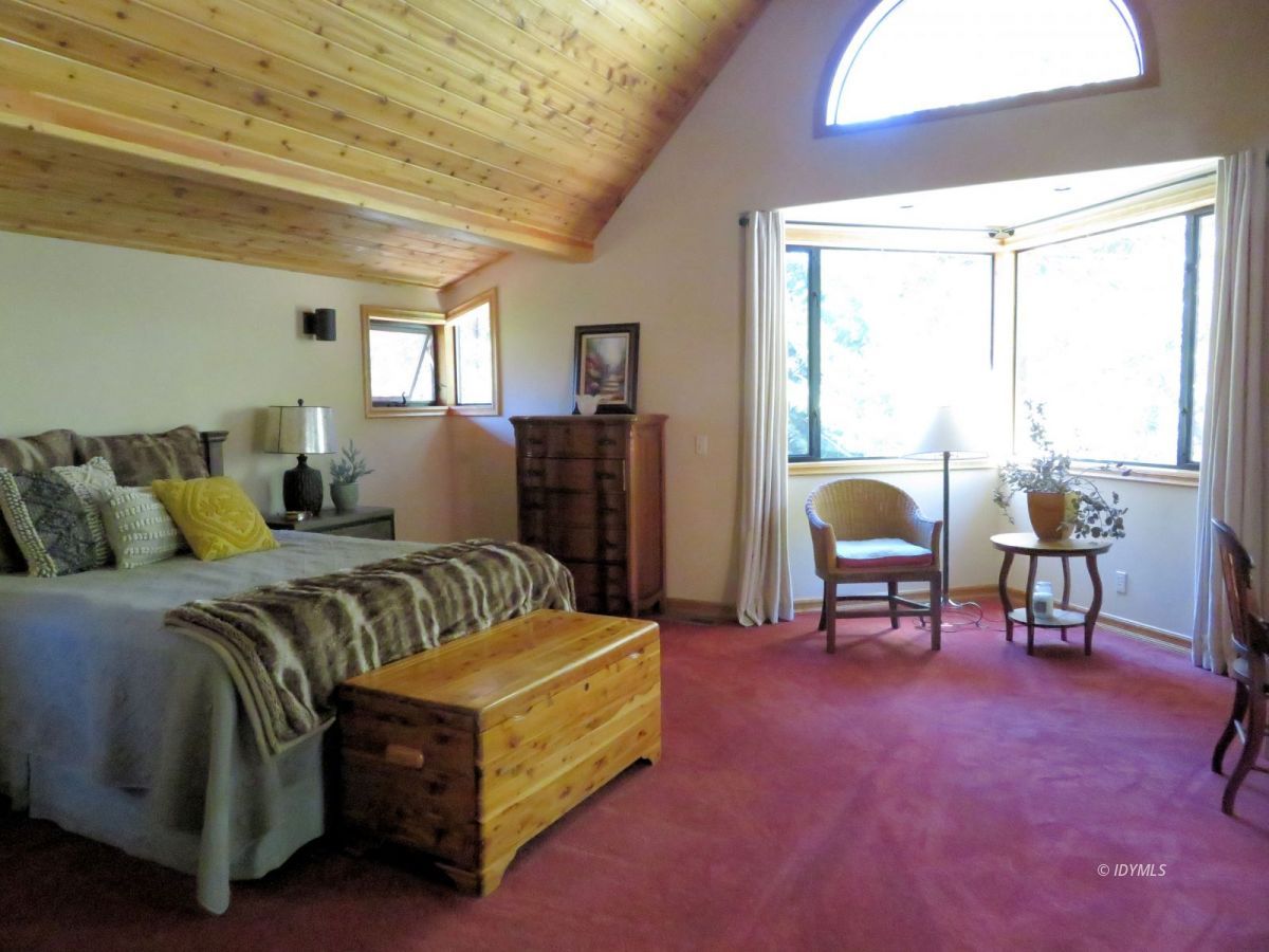 25553 Glen Rd Road Idyllwild, CA 92549 - Photo 10 of 20 a bedroom with a bed chair and a window