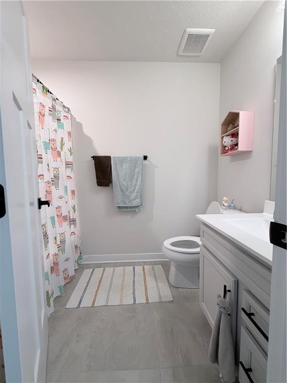 120 Crown Street McKees Rocks, PA 15136 - Photo 14 of 28 a bathroom with a sink a toilet and shower curtain