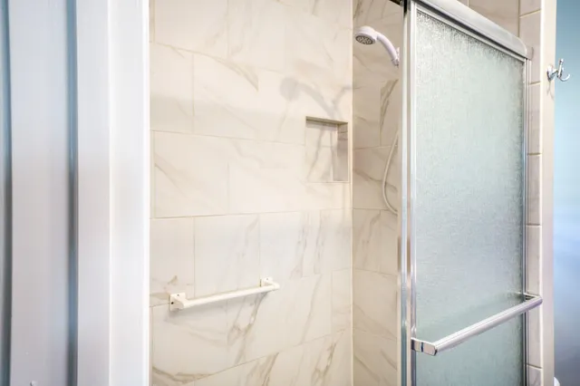 a bed room with a bed and a window