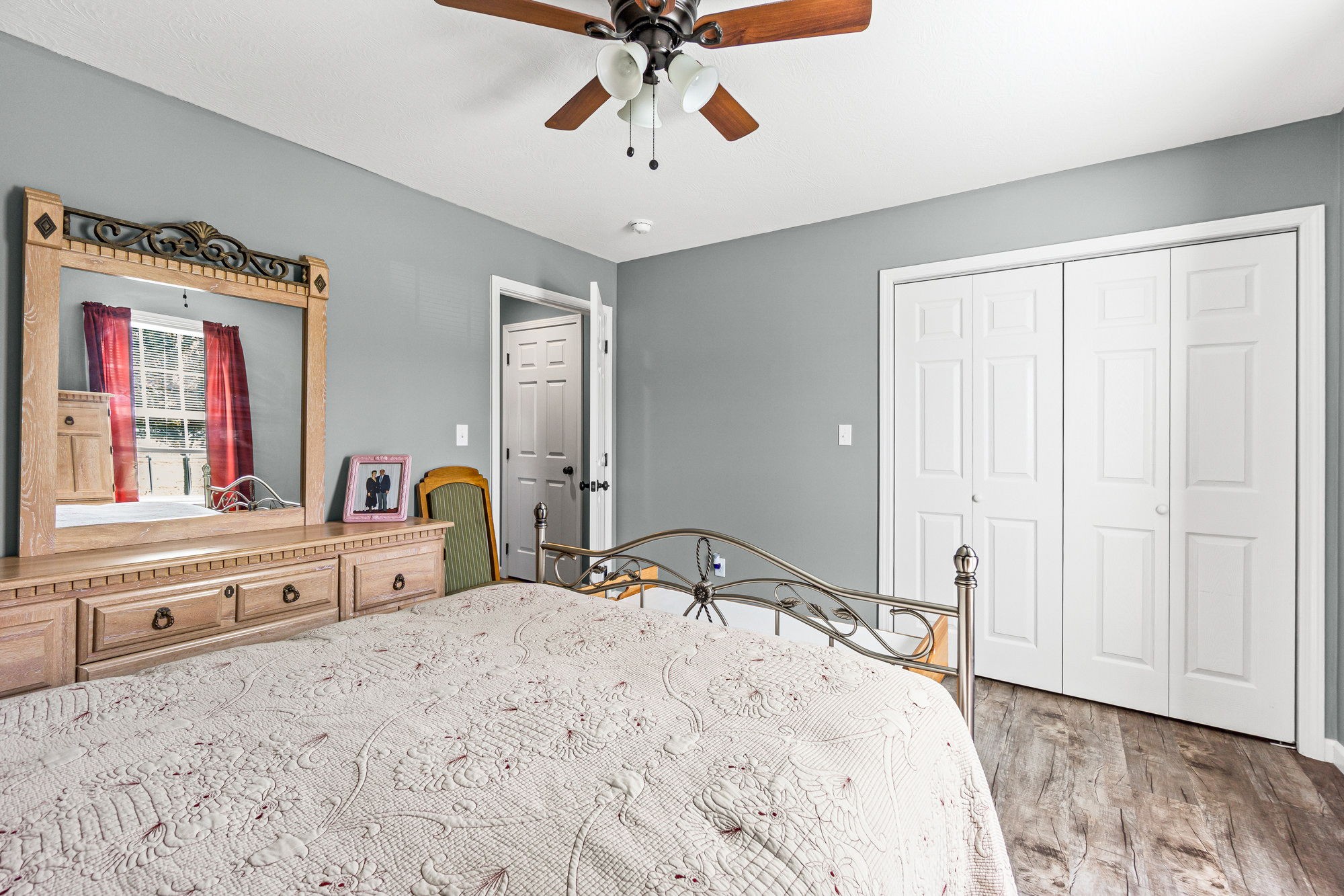 237 Fremont Road Doyle, TN 38559 - Photo 13 of 29 a bedroom with a large bed and a chandelier