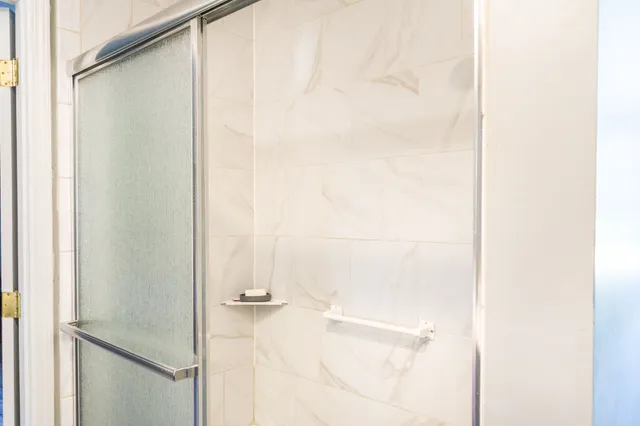 a bedroom with furniture and a baby crib