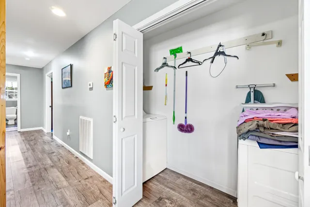 a spacious bedroom with a bed and a window