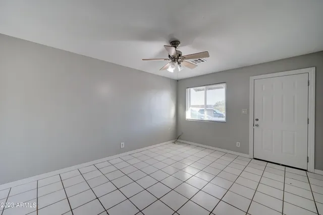 a view of an empty room with a window