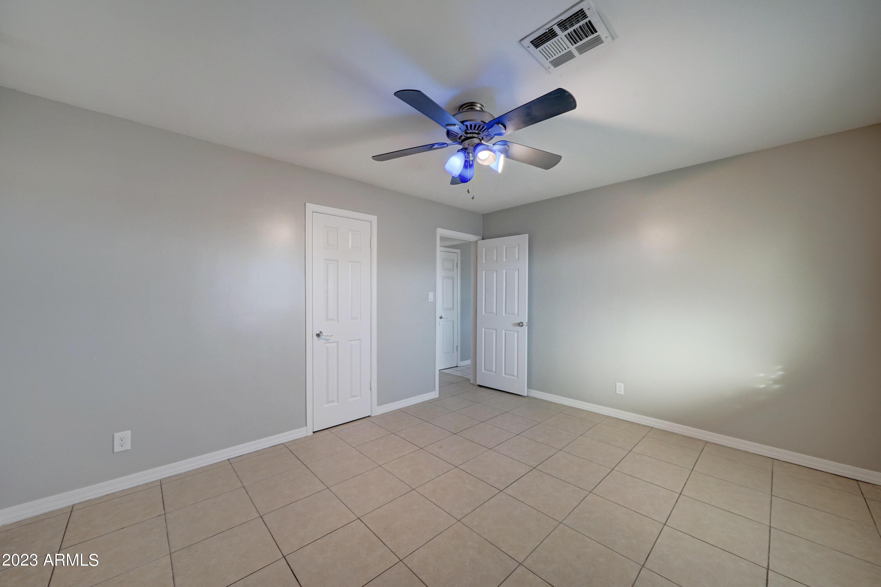 1202 North 49th Place, Unit A Phoenix, AZ 85008 - Photo 10 of 14 a view of an empty room