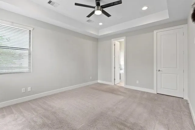 a view of an empty room and a window