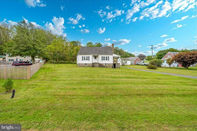 a view of a house with a big yard
