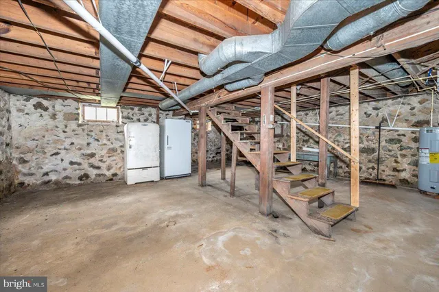 a view of an empty room with stairs