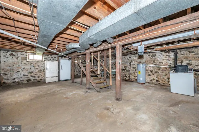 a view of empty room with wooden ceiling