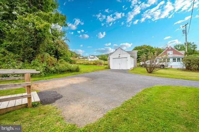 a view of a house with a yard porch and sitting area