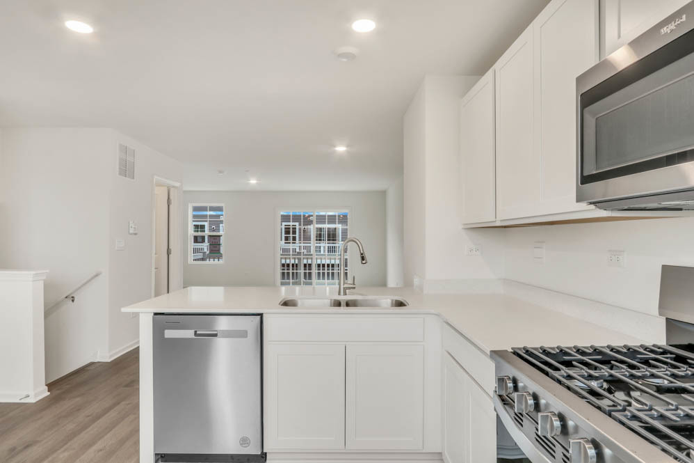 363 Bridgeview Court St. Charles, IL 60174 - Photo 7 of 28 a kitchen with stainless steel appliances a sink stove and cabinets