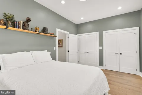 a large white bed in a white room