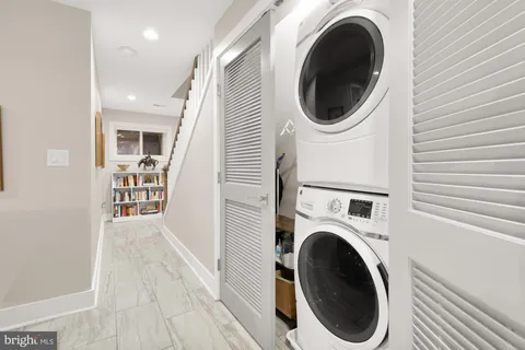 a view of a hallway with washer and dryer