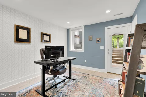 a workspace with furniture and window