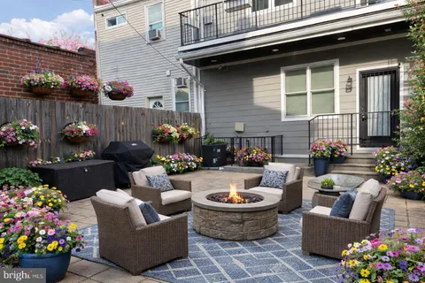 a outdoor living space with furniture and flowers