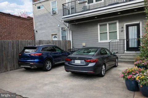 a car parked in front of a house