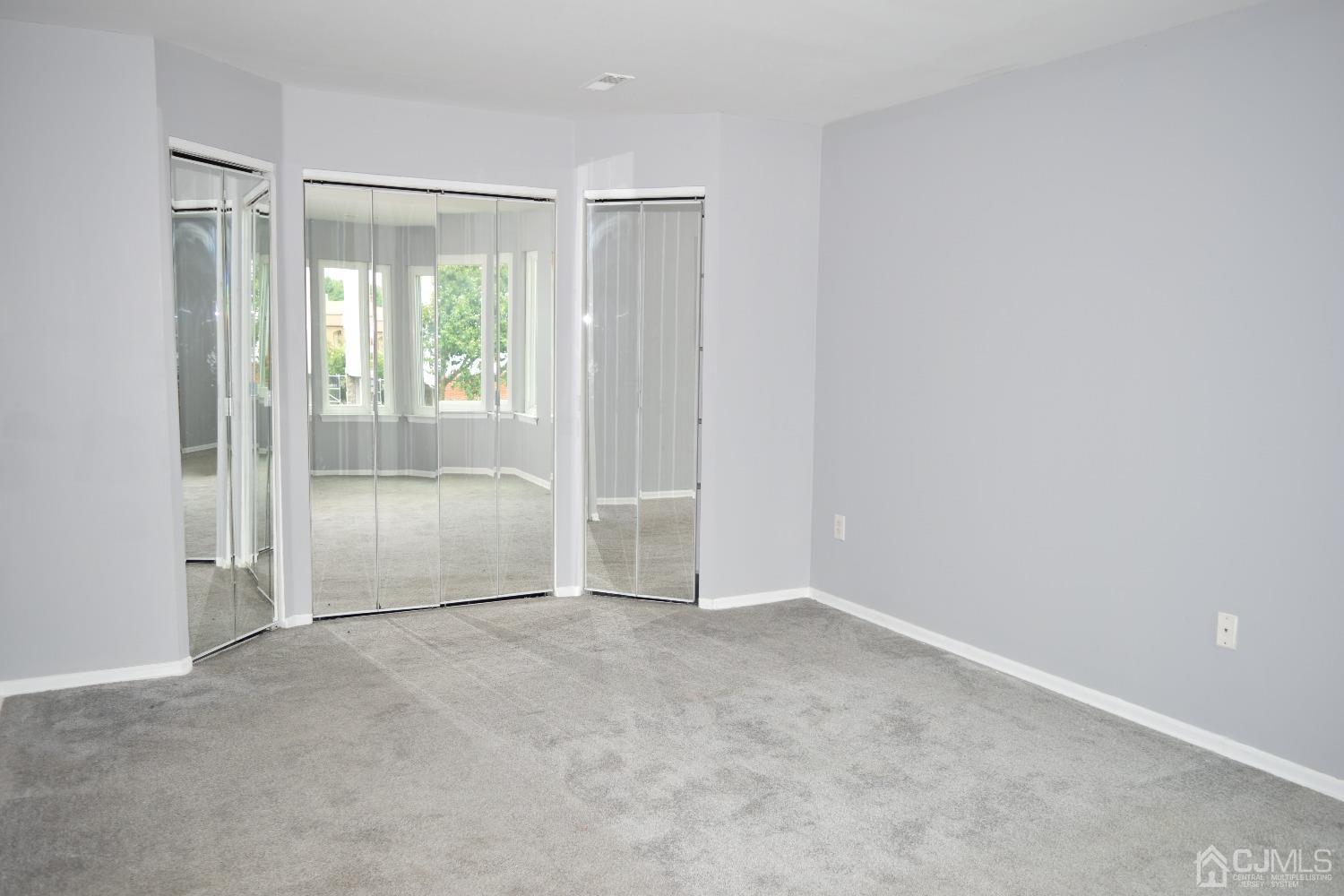 2303 Jesse Way Piscataway, NJ 08854 - Photo 6 of 9 a view of an empty room and window