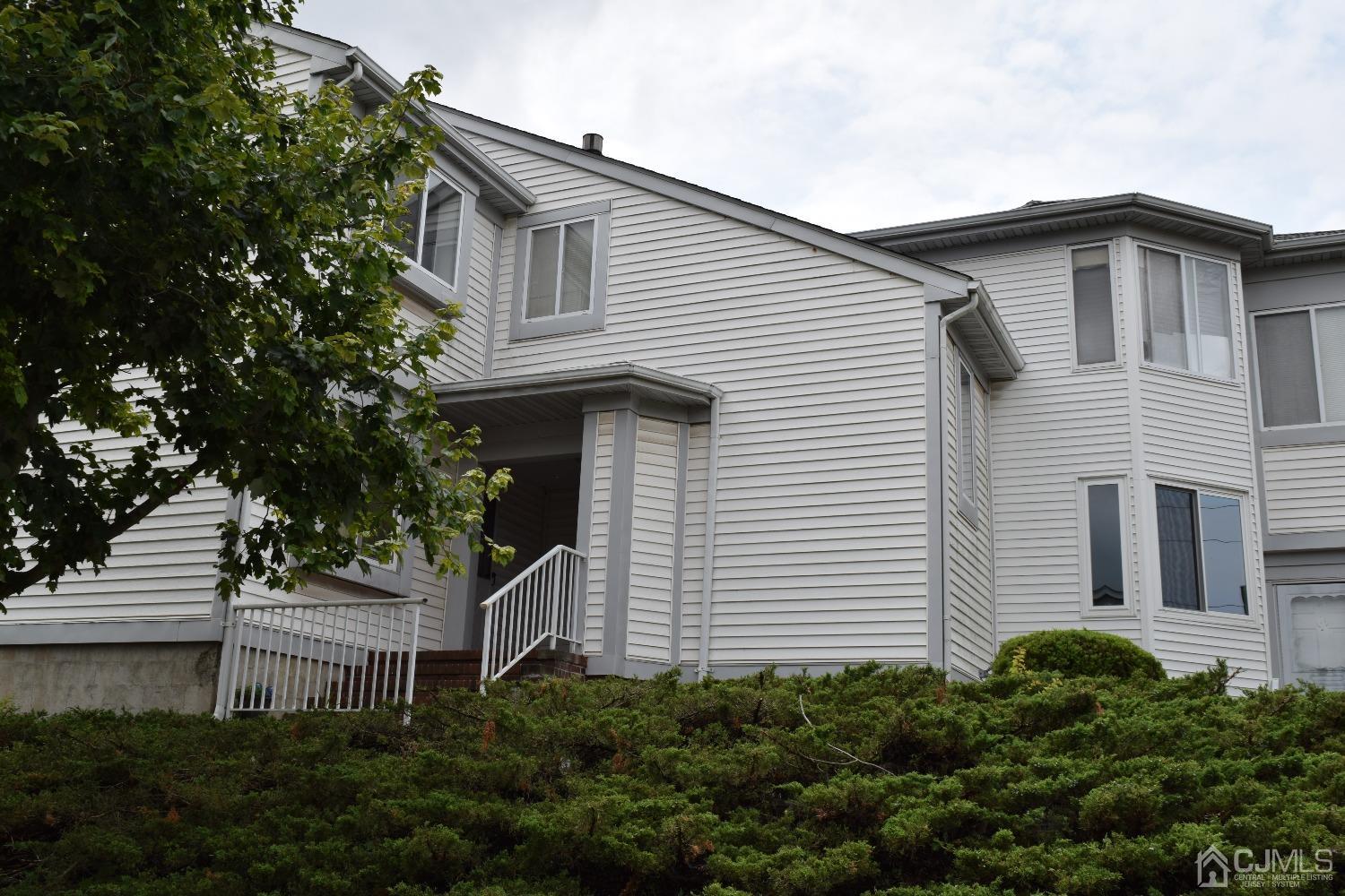 2303 Jesse Way Piscataway, NJ 08854 - Photo 9 of 9 a front view of a house with a garden