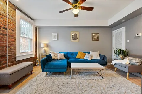 a living room with furniture and a window