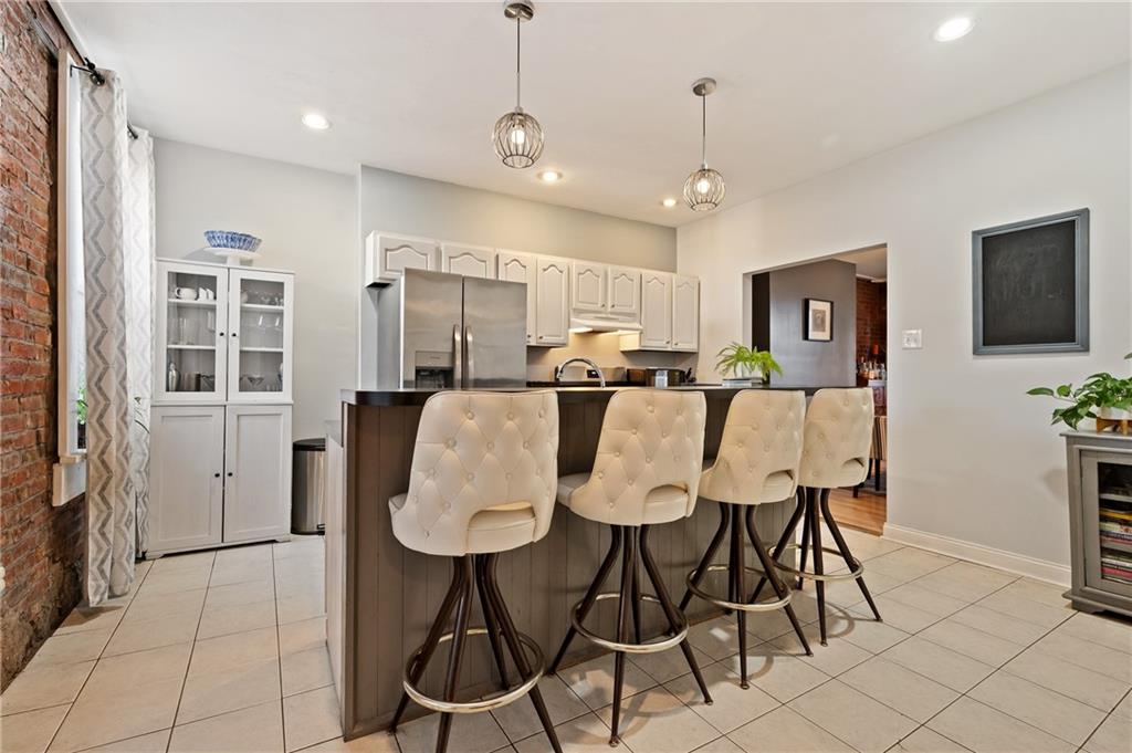 3037 Brereton Street Pittsburgh, PA 15219 - Photo 18 of 36 a view of a dining room with furniture