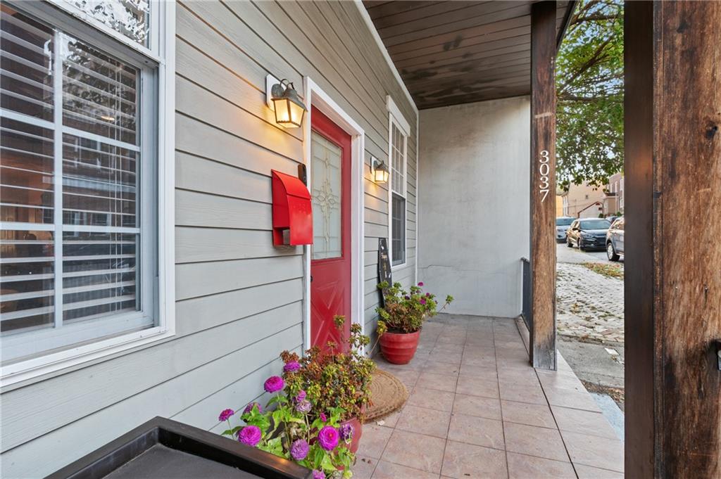3037 Brereton Street Pittsburgh, PA 15219 - Photo 2 of 36 a front view of a house with a potted plant