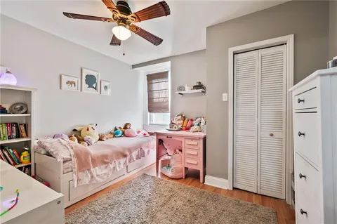 a bedroom with furniture and a window