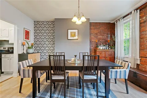 a view of a dining room with furniture window and outside view