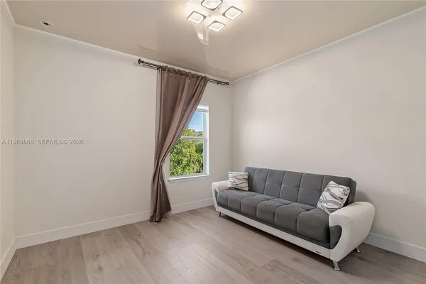 a living room with furniture and a window