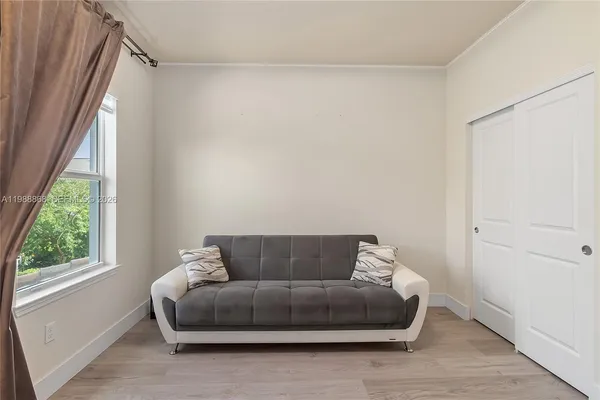 a living room with furniture and a window