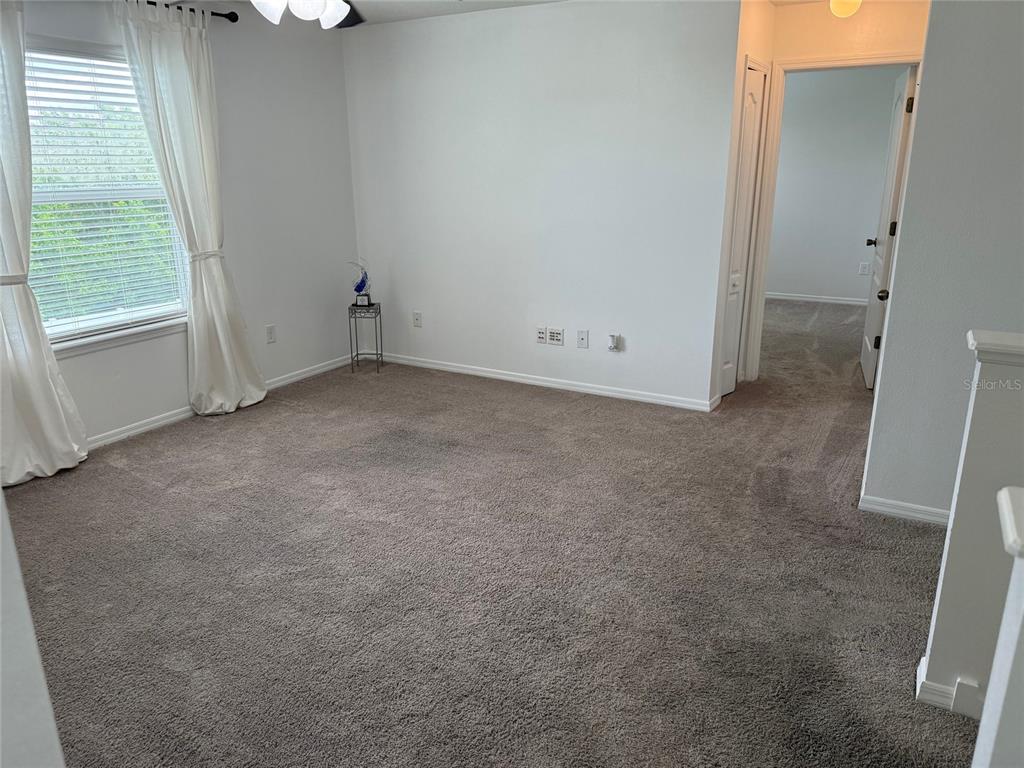 12236 Fairlawn Drive Riverview, FL 33579 - Photo 27 of 52 an empty room with windows