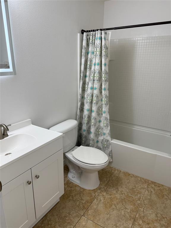 12236 Fairlawn Drive Riverview, FL 33579 - Photo 30 of 52 a white toilet sitting next to a bath tub