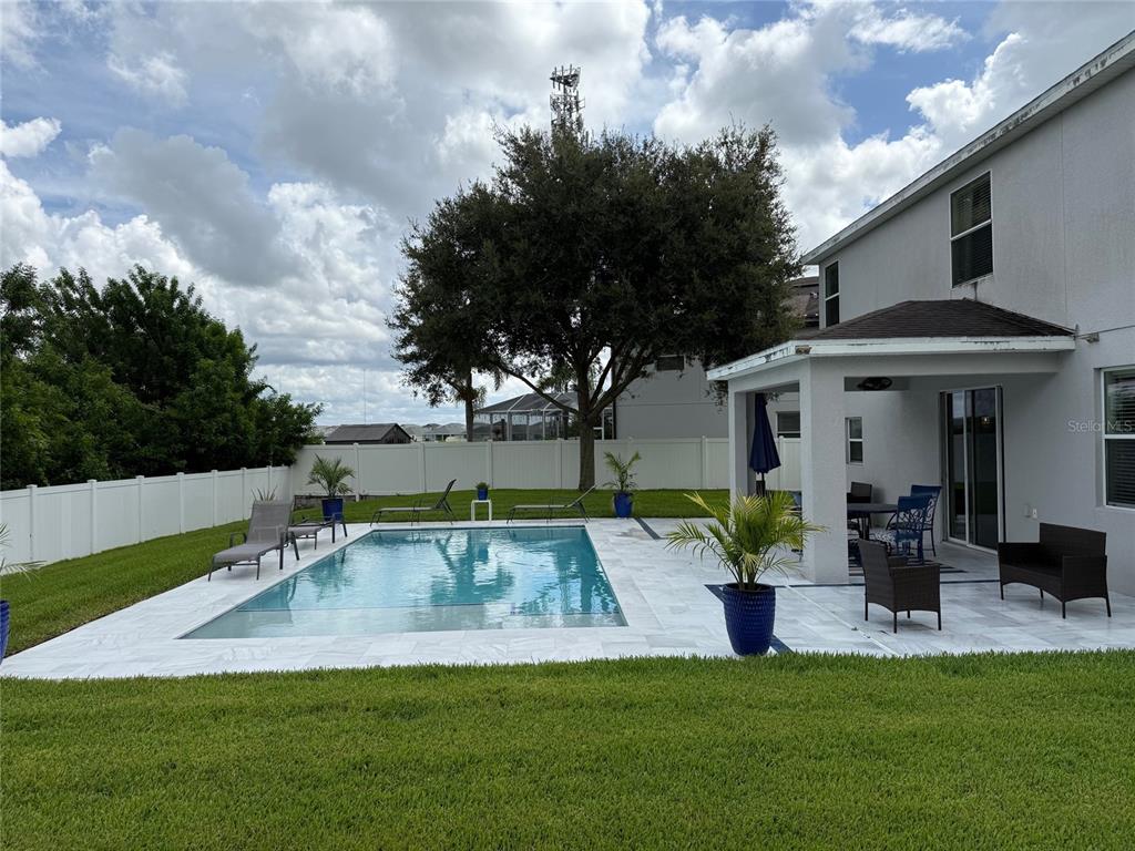 12236 Fairlawn Drive Riverview, FL 33579 - Photo 38 of 52 a view of a house with backyard porch and sitting area